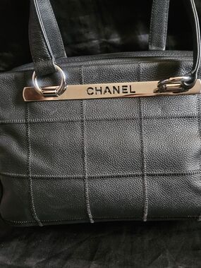CHANEL Black Quilted Leather Tote Bag with Metal Logo
